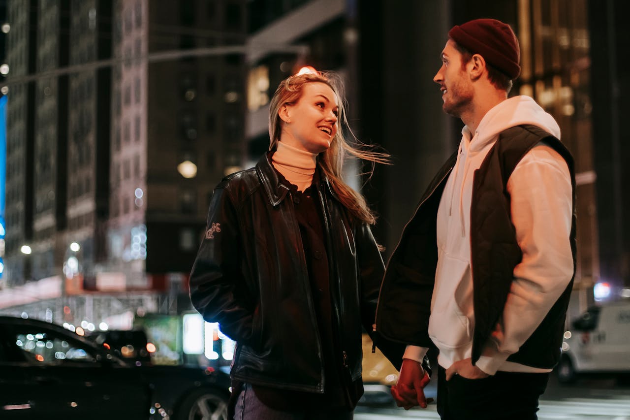 positive-couple-standing-near-road